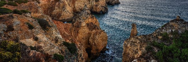 Wschód słońca, Cypel, Ponta da Piedade, Region Algarve, Portugalia, Skały, Morze