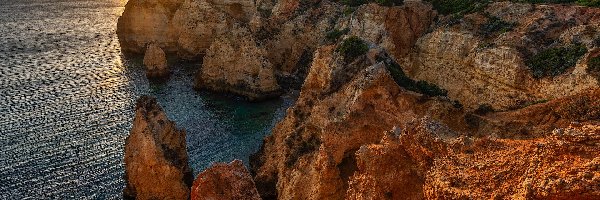 Zachód słońca, Cypel, Ponta da Piedade, Region Algarve, Portugalia, Skały, Morze